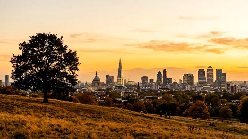 London skyline with The Shard and St Paul's seen from Parliament Hill at sunset.